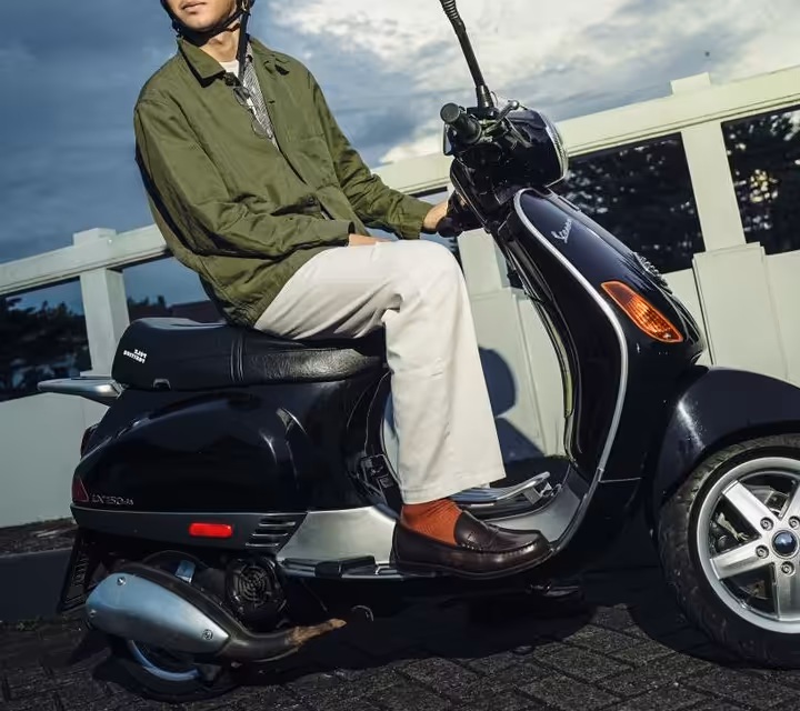 Custom Vespa seat with backrest in urban street culture gathering